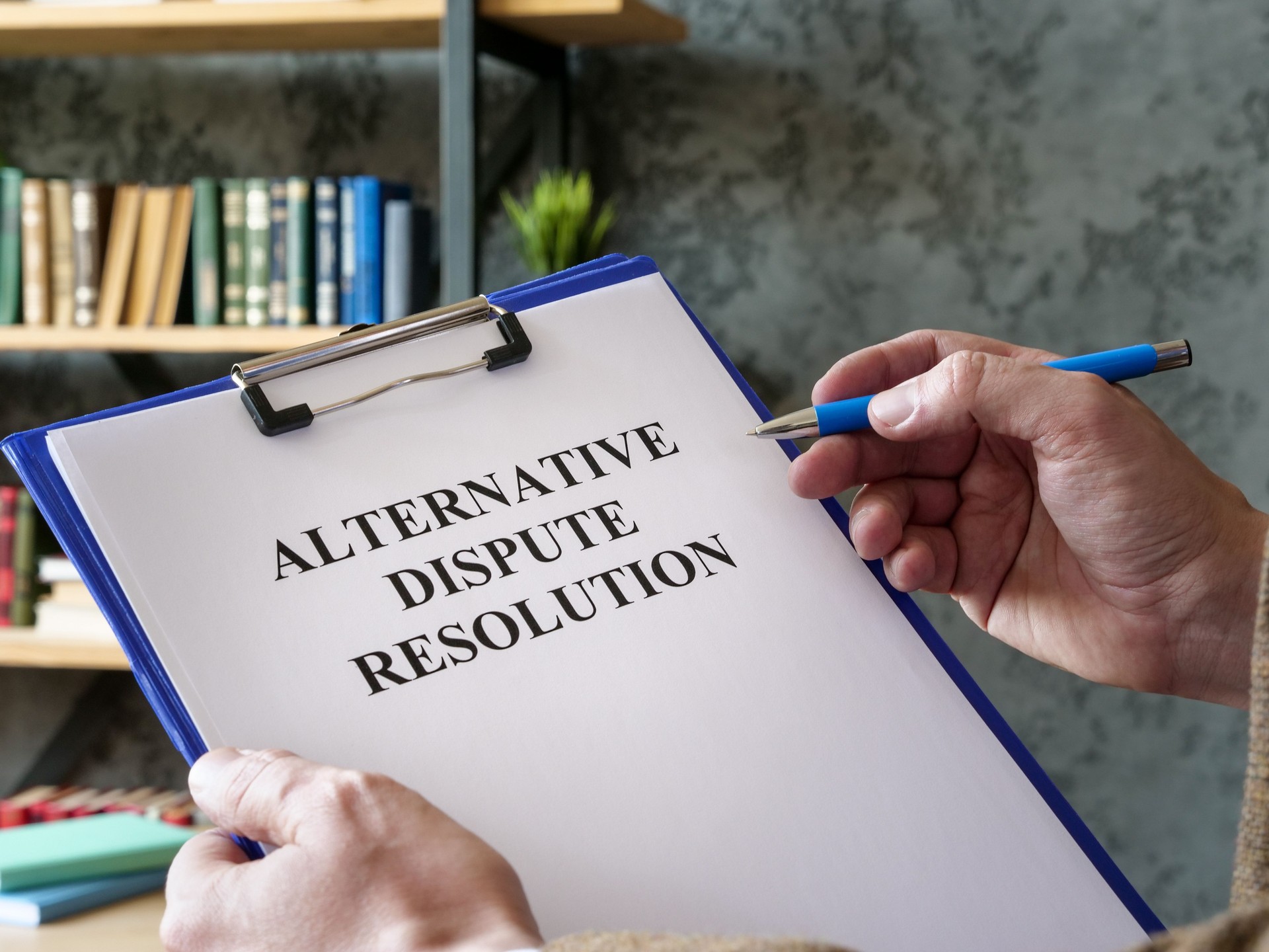 Man reads about alternative dispute resolution ADR.