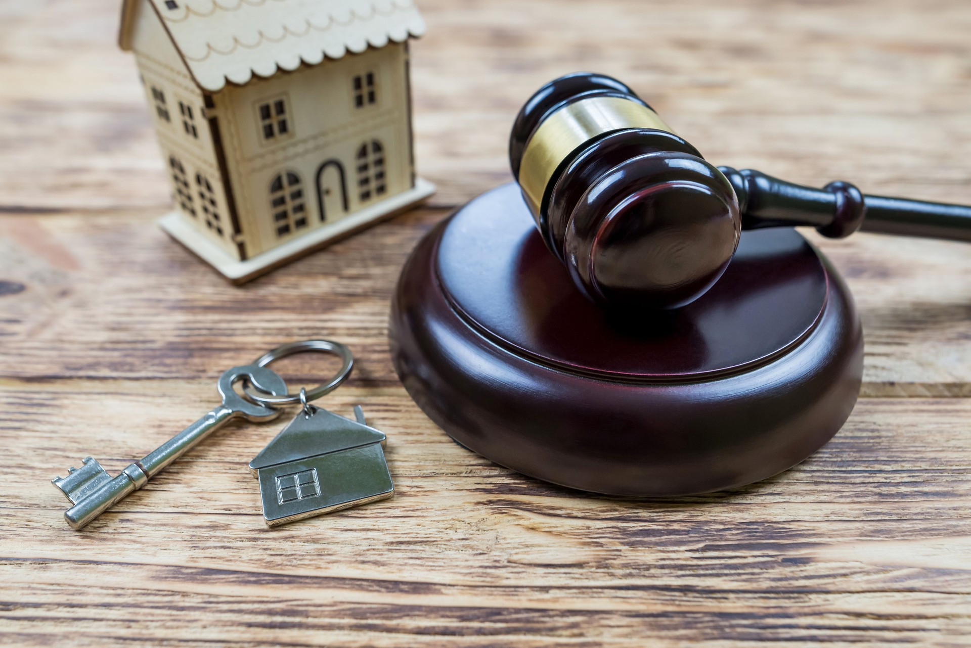 Real estate sale auction concept - gavel and house model